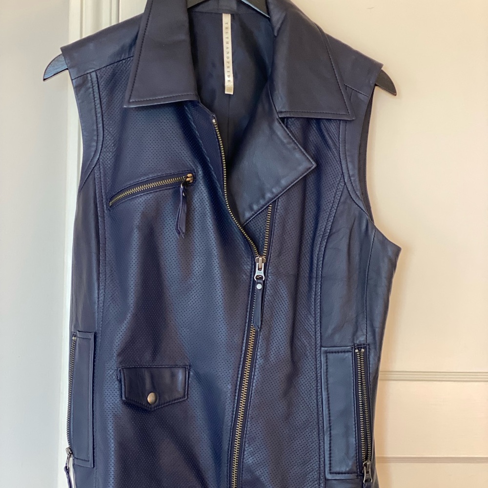 Truth and Pride, Large sleeveless leather vest in light purple color.